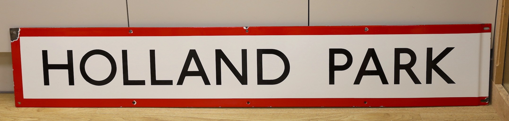 A London Underground enamel frieze panel sign, for Holland Park, 132 cms long, by J. Bruton and Sons